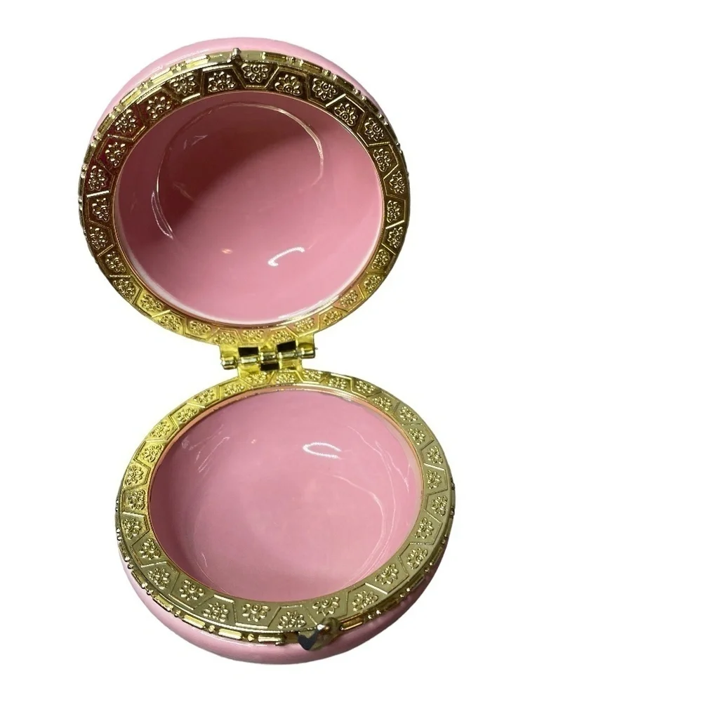pink macaron-shaped box is perfect for storing all your precious jewelry